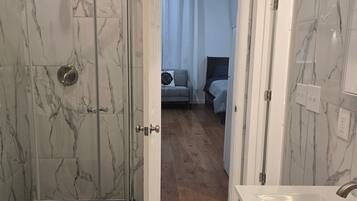 Shower, hair dryer, towels, soap