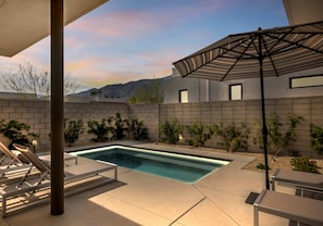 Outdoor pool, pool umbrellas, sun loungers