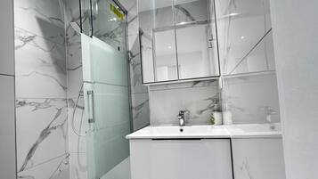 Shower, hair dryer, towels, soap