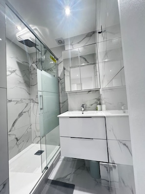 Shower, hair dryer, towels, soap