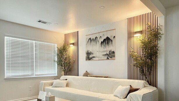 A modern living room with a beige sofa, a wooden coffee table, and a large window with blinds. - Chic Absolute - Your Next Urban Oasis (Atlanta)
