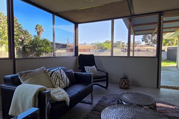 Enclosed porch with door out to private back garden.