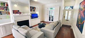 Smart TV, fireplace, books