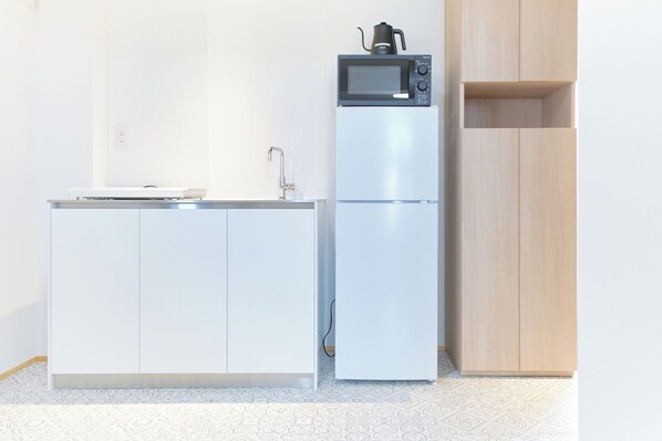 Apartment, Non Smoking (601, 3 people) | Private kitchen | Fridge, microwave, stovetop