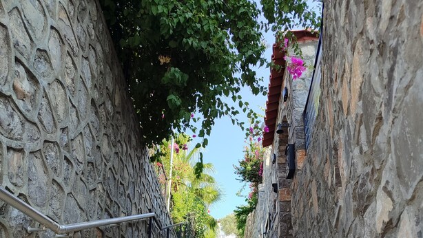 A stone staircase leading up to a building with a metal handrail on the left. - Villa Beyaz İnci Dalaman-Villa White Pearl Dalaman (Dalaman)