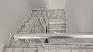 A marble staircase with metal handrails and a handrail extension. - Villa Beyaz İnci Dalaman-Villa White Pearl Dalaman (Dalaman)
