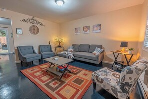 Smart TV, fireplace, books, printers