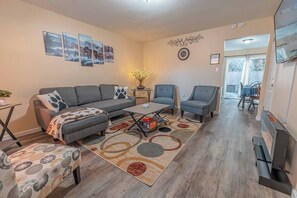 Smart TV, fireplace, books, printers