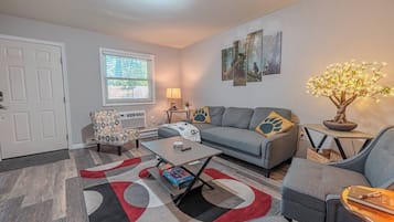 Smart TV, fireplace, books, printers