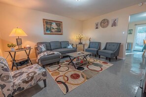 Smart TV, fireplace, books, printers