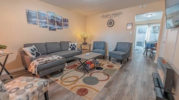 Smart TV, fireplace, books, printers