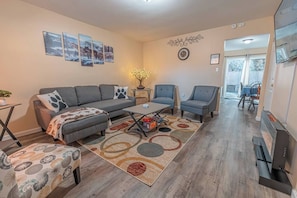 Smart TV, fireplace, books, printers