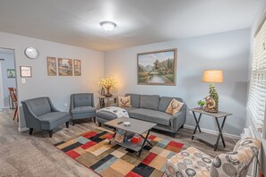 Smart TV, fireplace, books, printers