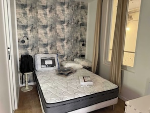 Apartment | Laptop workspace, iron/ironing board, bed sheets