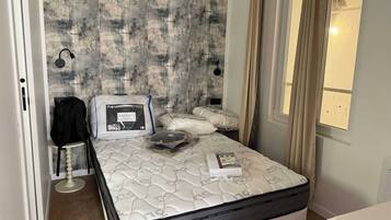 1 bedroom, laptop workspace, iron/ironing board, bed sheets