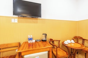Family Quadruple Room | Living area | Flat-screen TV
