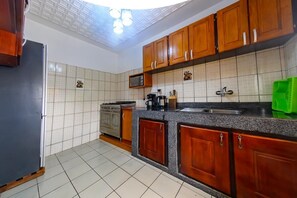 Fridge, microwave, stovetop, cookware/dishes/utensils