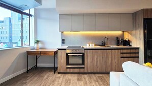 Coffee/tea maker, fridge, microwave, stovetop - Modern 2BR Apartment in Lower Hutt's Heart (Lower Hutt)