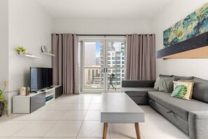 TV - Stylish 1BR | Pool, Gym Access & City Skyline Views near JBR Beach (Marina)