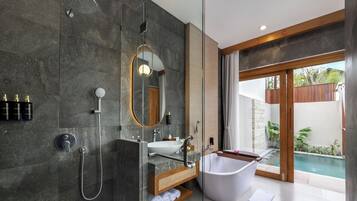 Separate tub and shower, rainfall showerhead, free toiletries