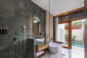 Separate tub and shower, rainfall showerhead, free toiletries