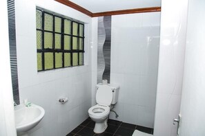 Shower, rainfall showerhead, slippers, towels