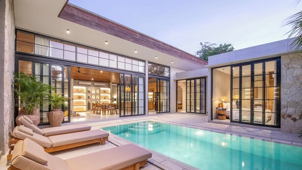 A modern house with a swimming pool, large windows, and a dining area. - Bohemian Lush 5BR Retreat, 5 Mins to Bingin Beach (Pecatu)