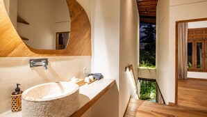 A modern bathroom with a large oval sink, a wooden vanity, and a large mirror. - Stylish 1-br Villa With Pool, 800m to Echo Beach (Canggu)