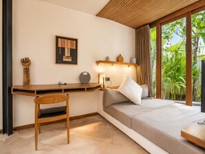 A modern room with a desk, chair, bed, and large windows. - Stunning 1-br Villa With Pool, Echo Beach 4mins (Canggu)