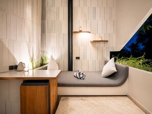 A modern bathroom with a wooden bench, a sink, and a shelf with a vase. - Exquisite 1-br Loft Art Deco Charm Shared Pool (Canggu)