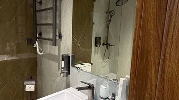 Shower, hair dryer, slippers, soap