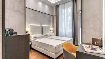 Habitación Deluxe con 1 cama matrimonial o 2 individuales | Ropa de cama de alta calidad y caja de seguridad en la habitación