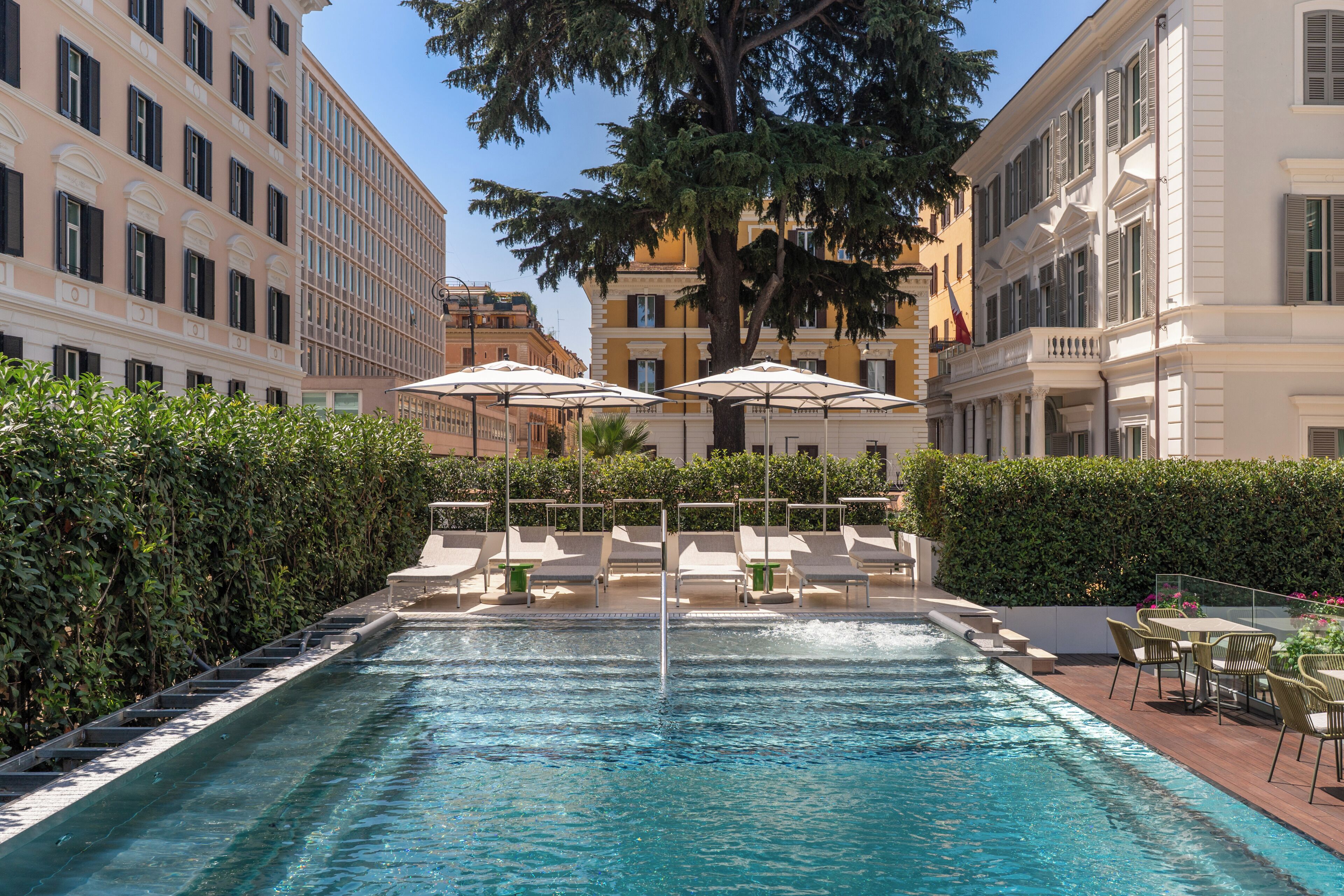 Seasonal outdoor pool, open 10:30 AM to 8:30 PM, pool umbrellas