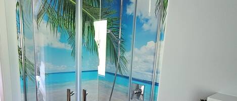 Shower, hair dryer, towels, soap