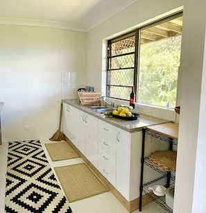 Fridge, microwave, stovetop, coffee/tea maker