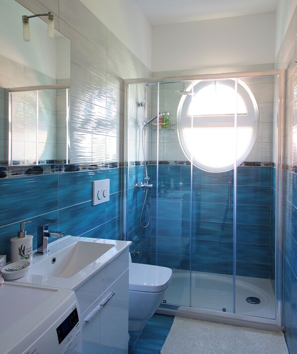Shower, hair dryer, towels, soap