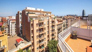 A multi-story residential building with balconies, a rooftop terrace, and a view of the cityscape. - A3IND1123- Ático near Sagrada Familia (Barcelona)