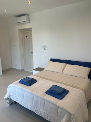 Premium bedding, down duvets, memory-foam beds, in-room safe
