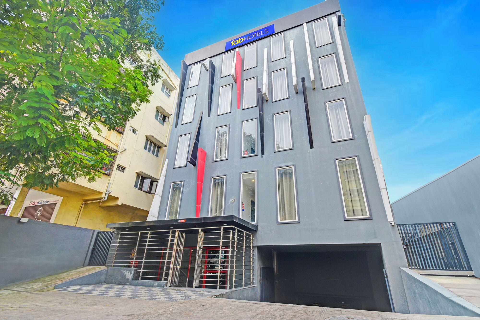 A modern building with a sign reading "fabHOTELS" at the top.