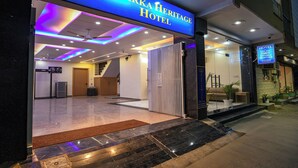 The exterior of Dwarka Heritage Hotel with a modern entrance, a reception area visible inside, and a staircase leading to the upper floors. - FabHotel Dwarka Heritage - Nr. Yashobhoomi Convention Centre (New Delhi)