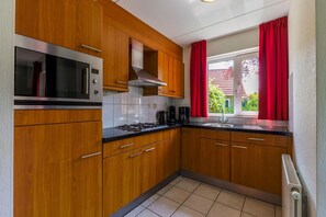 Microwave, stovetop, dishwasher, coffee/tea maker