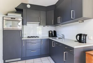 Microwave, stovetop, dishwasher, coffee/tea maker