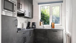 Microwave, stovetop, dishwasher, coffee/tea maker