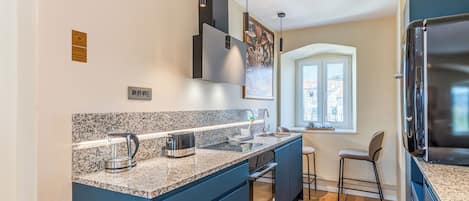 Deluxe Condo | Private kitchen | Electric kettle