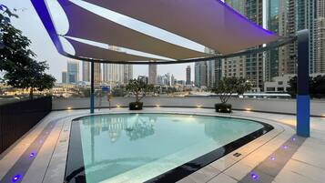 Outdoor pool, open 7:00 AM to 10:00 PM, pool umbrellas, sun loungers