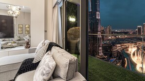 Superior Apartment, Balcony, City View | Living area | 65-inch LED TV with digital channels, video game console, Netflix - Gogoto1 2BR Burj Khalifa, Fountain View Dubai Mall (Downtown Dubai)