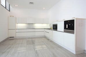 Villa | Private kitchen | Full-sized fridge, microwave, oven, stovetop