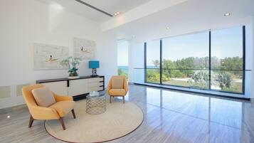 Villa | Living area | 55-inch Smart TV with digital channels