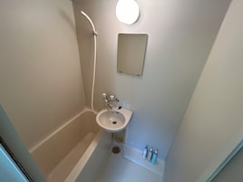 Family Apartment, Non Smoking, Balcony (402) | Bathroom | Combined shower/tub, hair dryer, towels, soap
