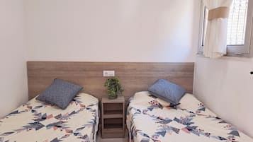 2 dormitorios, tabla de planchar con plancha, wifi y ropa de cama